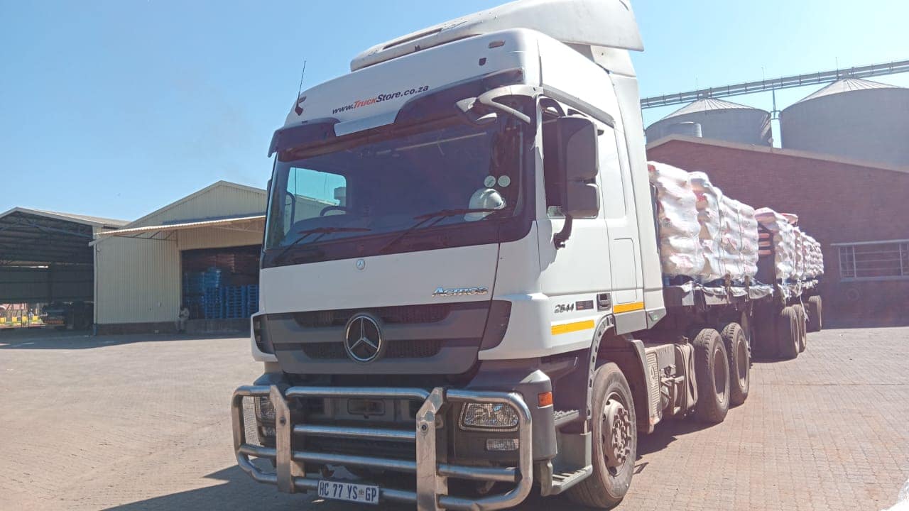 Mercedes-Benz Actros 2644 truck tractor coupled to a loaded superlink flatdeck