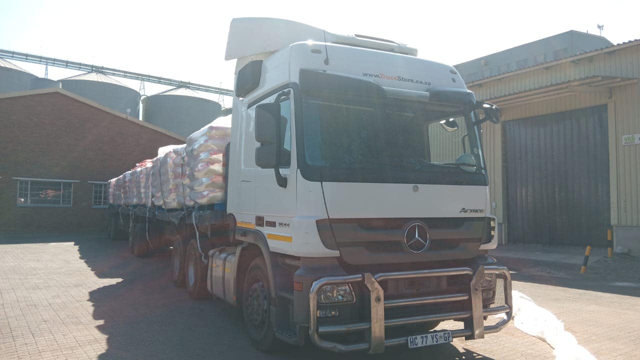 Superlink flatdeck combination loaded with bagged product at a mill
